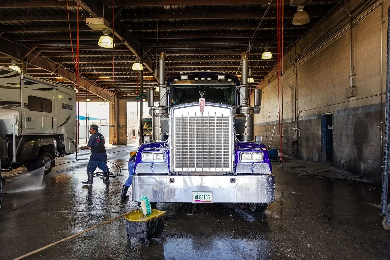 Steam cleaning a truck engine bay